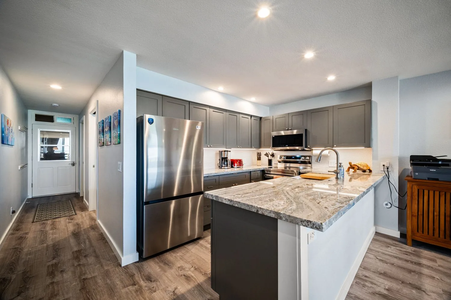 Kitchen and hallway — the WiFi printer station sits at right