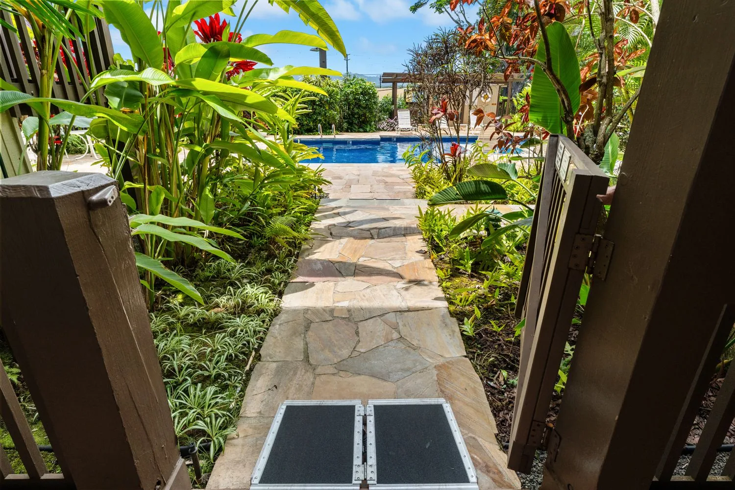 Pool path with portable ramp